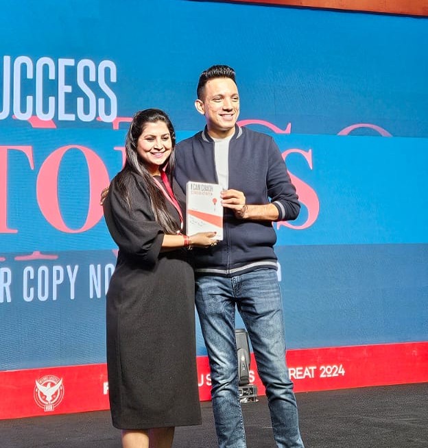 Preeti with Siddharth Rajsekar holding her book